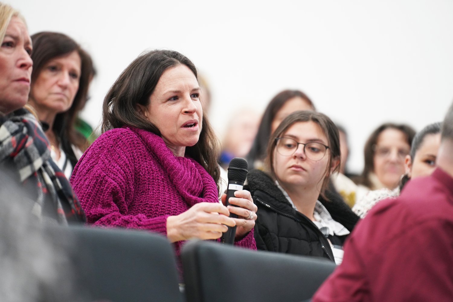 An engaged participant asks a question, driving meaningful dialogue.