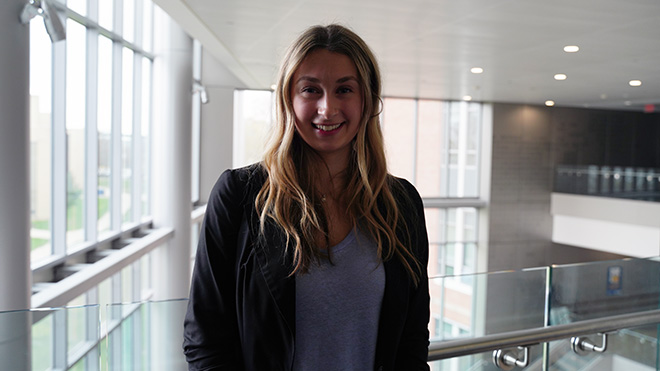 A student standing in GHH 