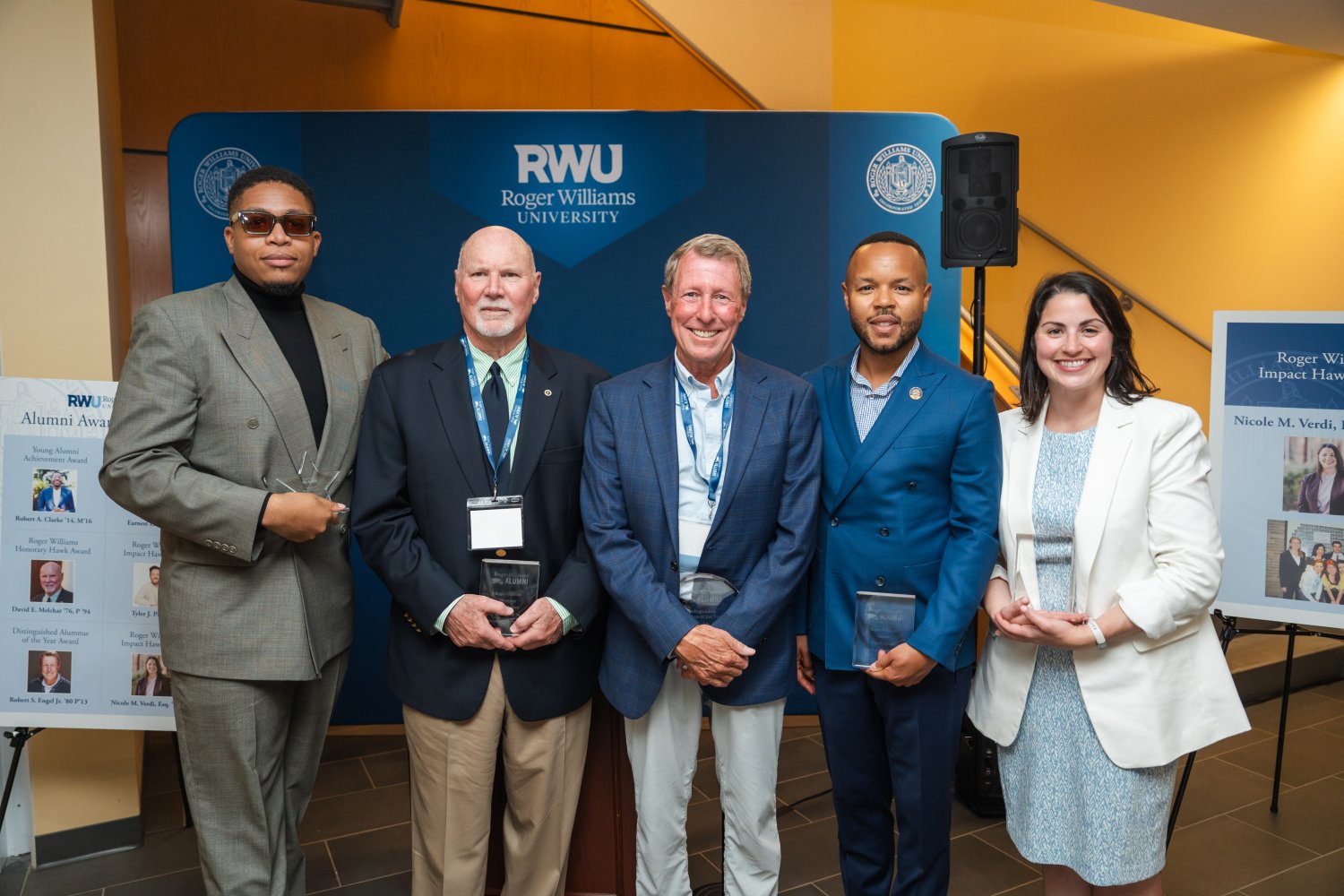 Alumni award recipients accept their honors during a special reception.