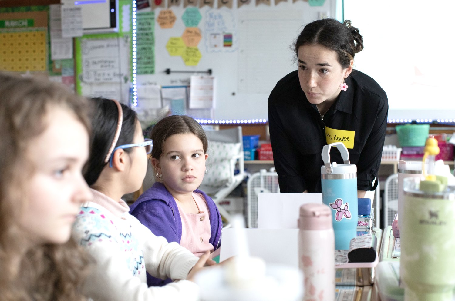 Elementary Education major Kaylee Jackson guides fourth graders at Guiteras Elementary School through the engineering design process.