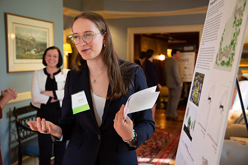 A student presents research at the symposium