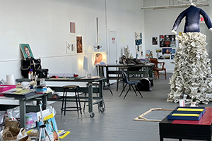 I'mage of art in white studio space with large sculpture visible