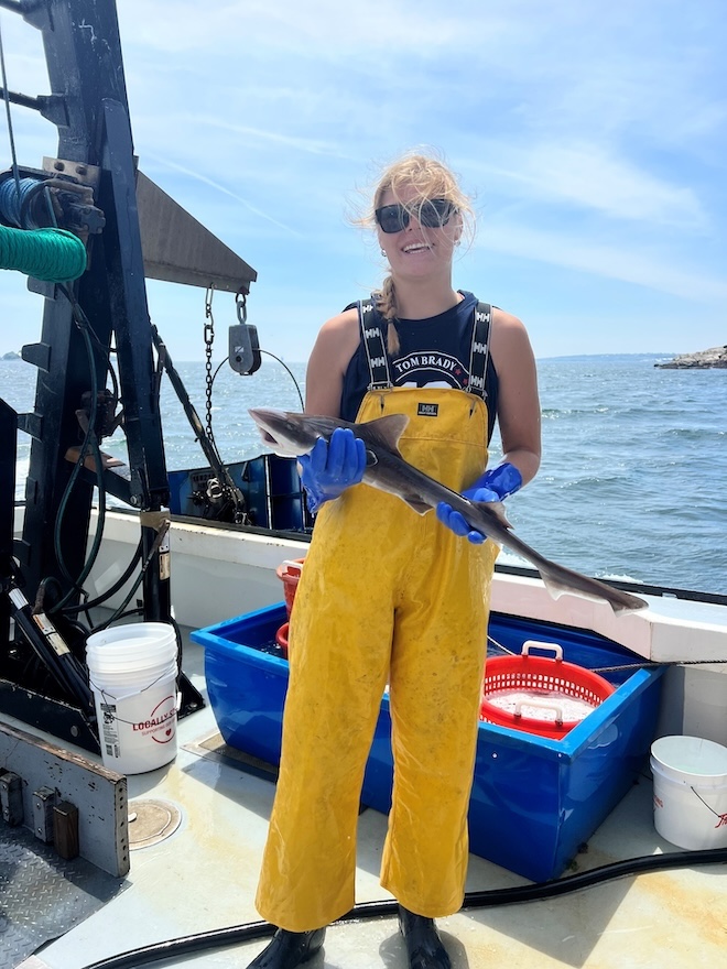 RWU student holds smooth dogfish.