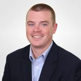 A headshot of Jospeh Mckenna