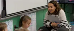 Student teacher works with students in classroom