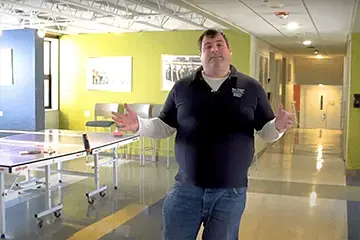 image of Danny DiCamillo, Assistant Director of Residence Life, giving first-year housing tour