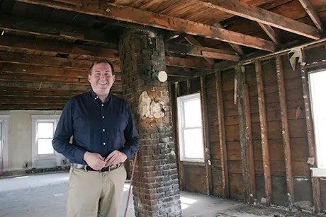 Ben Bergenholtz inside a building under renovation.