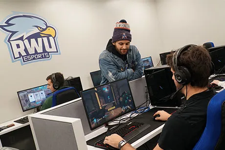 Gamers play on the new video game stations.
