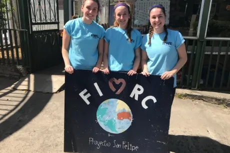 RWU Students hold FIMRC sign.
