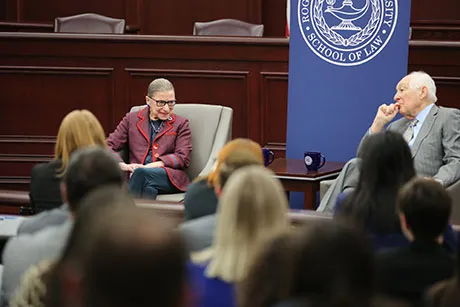 U.S. Supreme Court Justice Ruth Bader Ginsburg talks to 1st U.S. Circuit Court of Appeals Senior Judge Bruce M. Selya