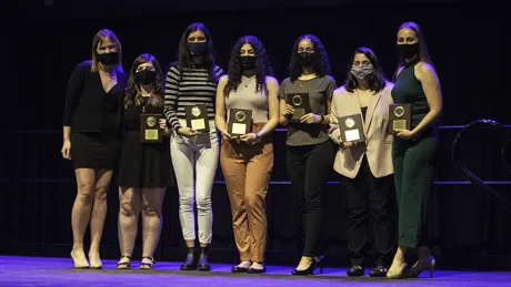 Students pose with awards