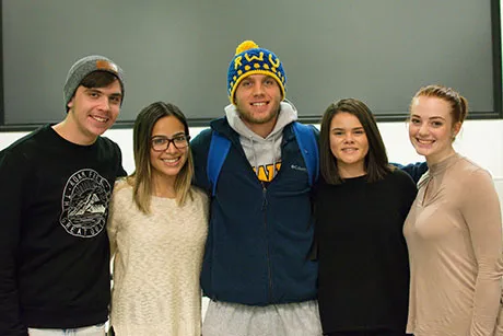 Five students posing for a photo