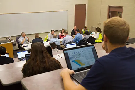 students in construction meeting