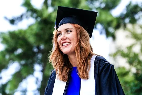 women in cap and gown