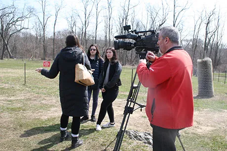 Journalism students learning in the field.