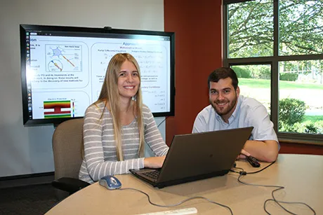 Students work on math modeling program.