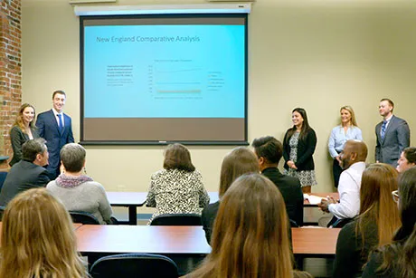 Students present their report to state officials.