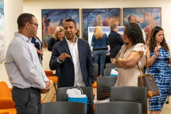 Graduate students talking to each other