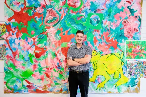 Art student infront of colorful combinations