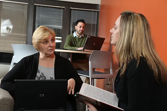 Student speaking with another student