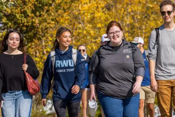 Smiling RWU students walking on campus
