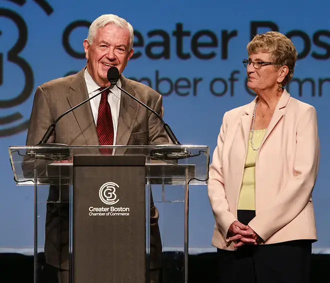 image of Bill Cummings speaking at podium with Joyce Cummings of Cummings Foundation