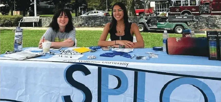 Students sitting at SPLO involvement table