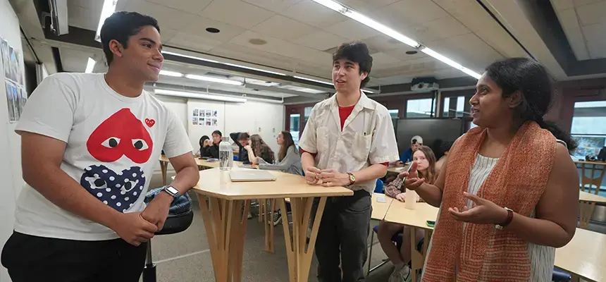 Students collaborate around a table
