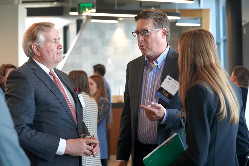 Real Estate Symposium attendees engage in deep discussions.