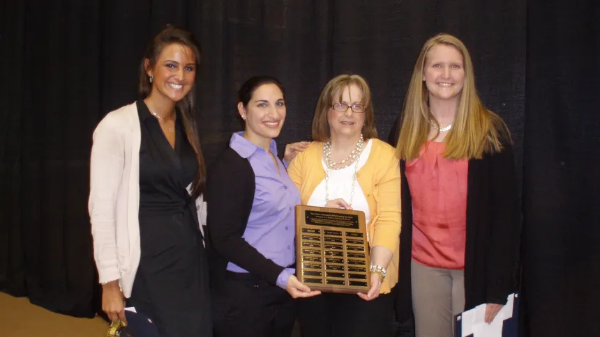 From left: 2012 Henderson Outstanding Tutor Award recipients Casey Klosowski in math, Lauren Salerno in science, (Coordinator of the Writing Center Karen Bilotti) and Leigh Wilmot in writing.