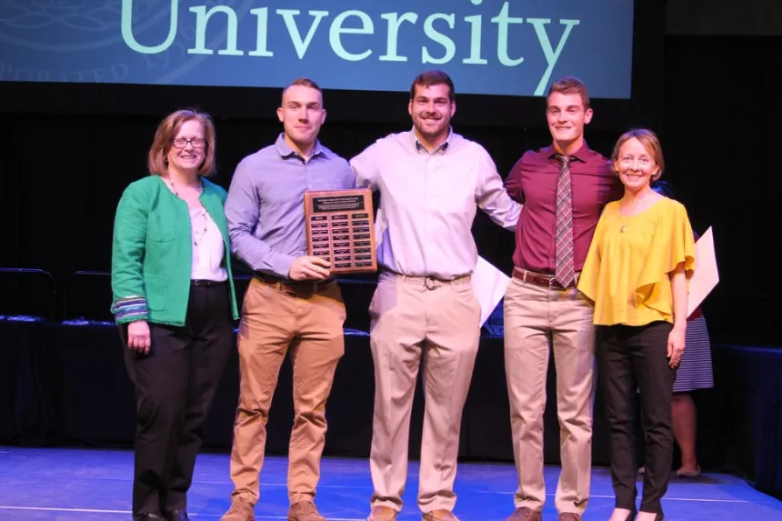 From left: 2018 Henderson Outstanding Tutor Award recipients Noah Pushor in writing, Andrew DelSanto in math, and Ryan Fontaine in science. They are congratulated by Coordinator of Writing Center Karen Bilotti (far left) and Coordinator of Science Center Tracey McDonnell Wysor (far right).