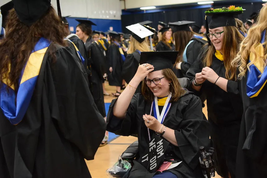 students preparing for graduation ceremony
