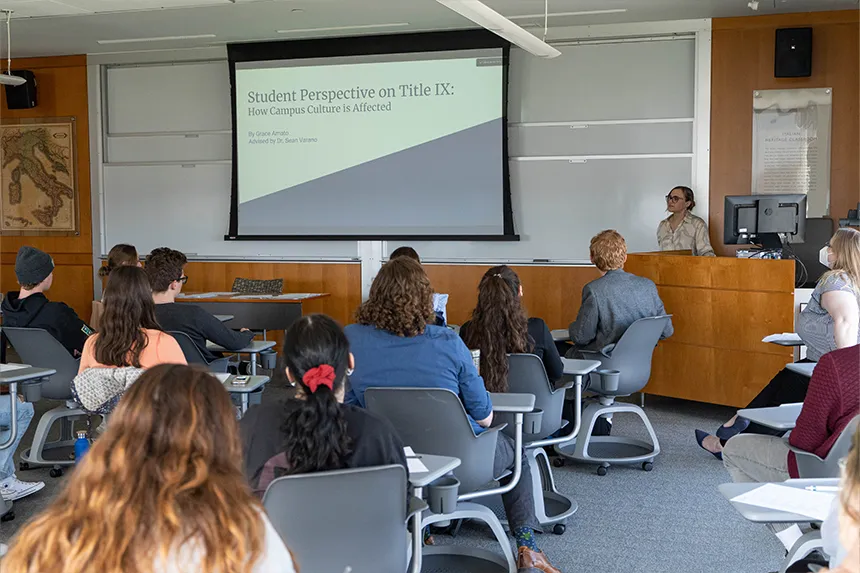 A student presenting to a class of students during SASH 