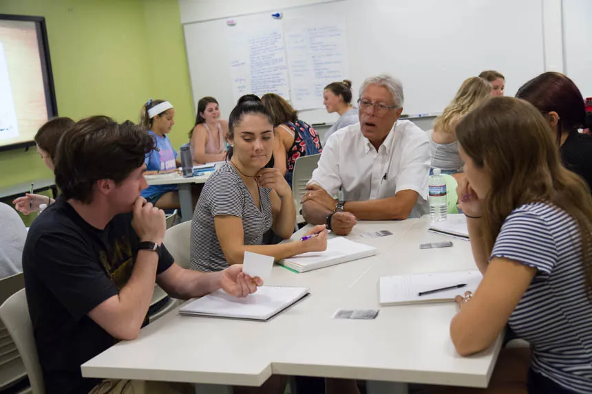 student in class with professor