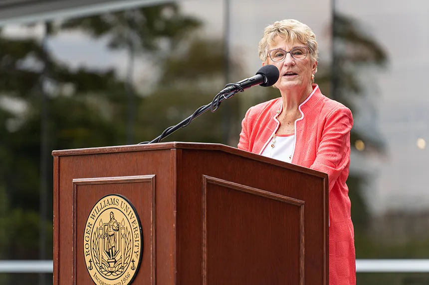 Joyce Cummings speaking at a podium