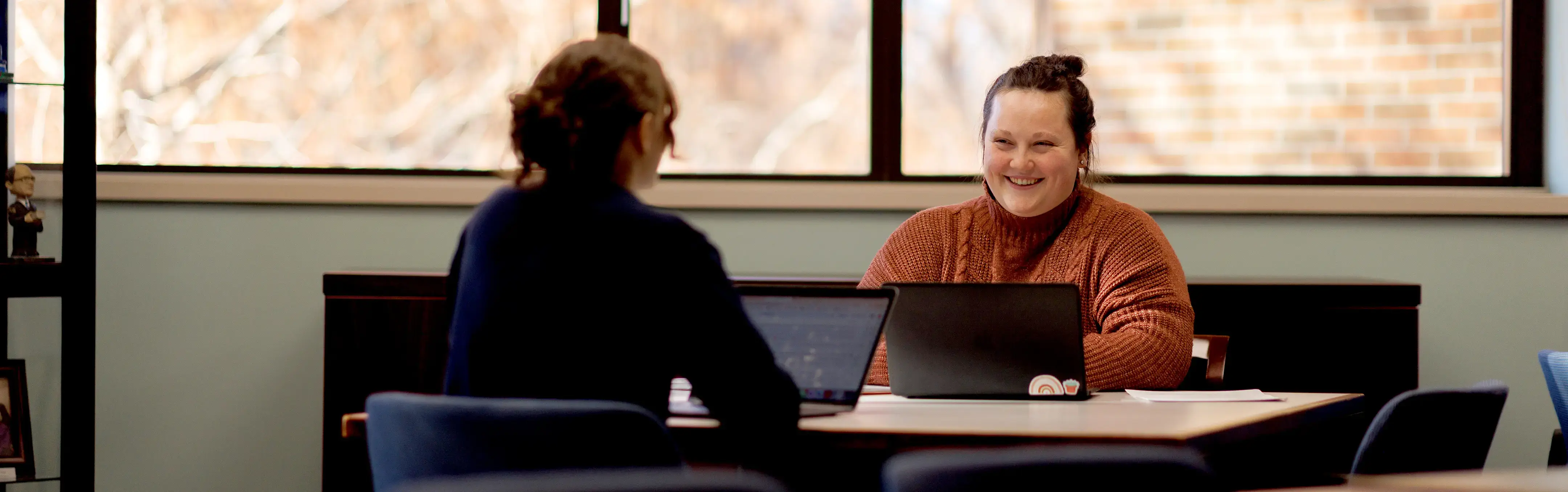 Two woman discuss case management 