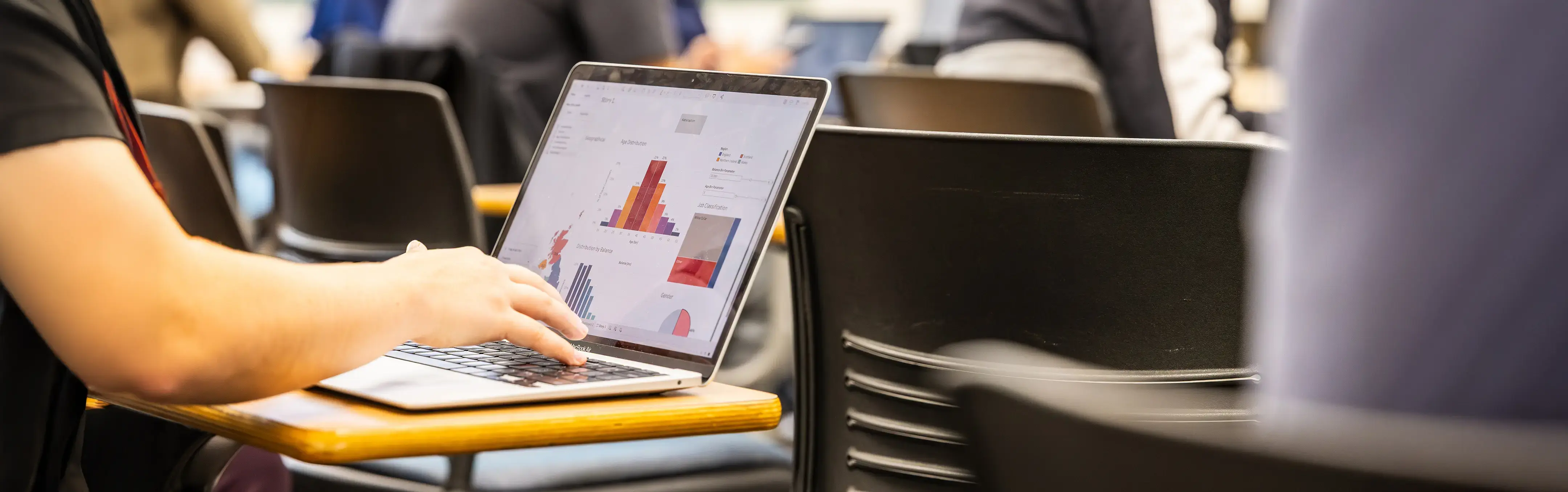 A student runs analytical analysis on a computer 